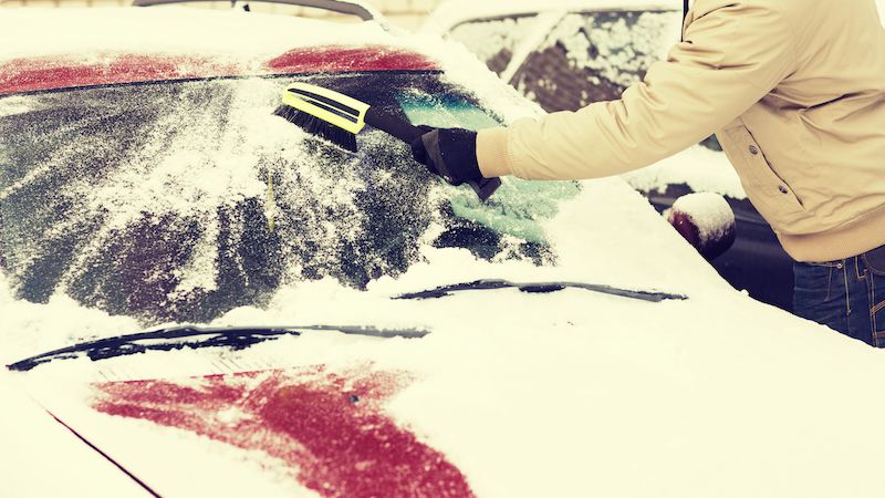 Snow brush on windshield